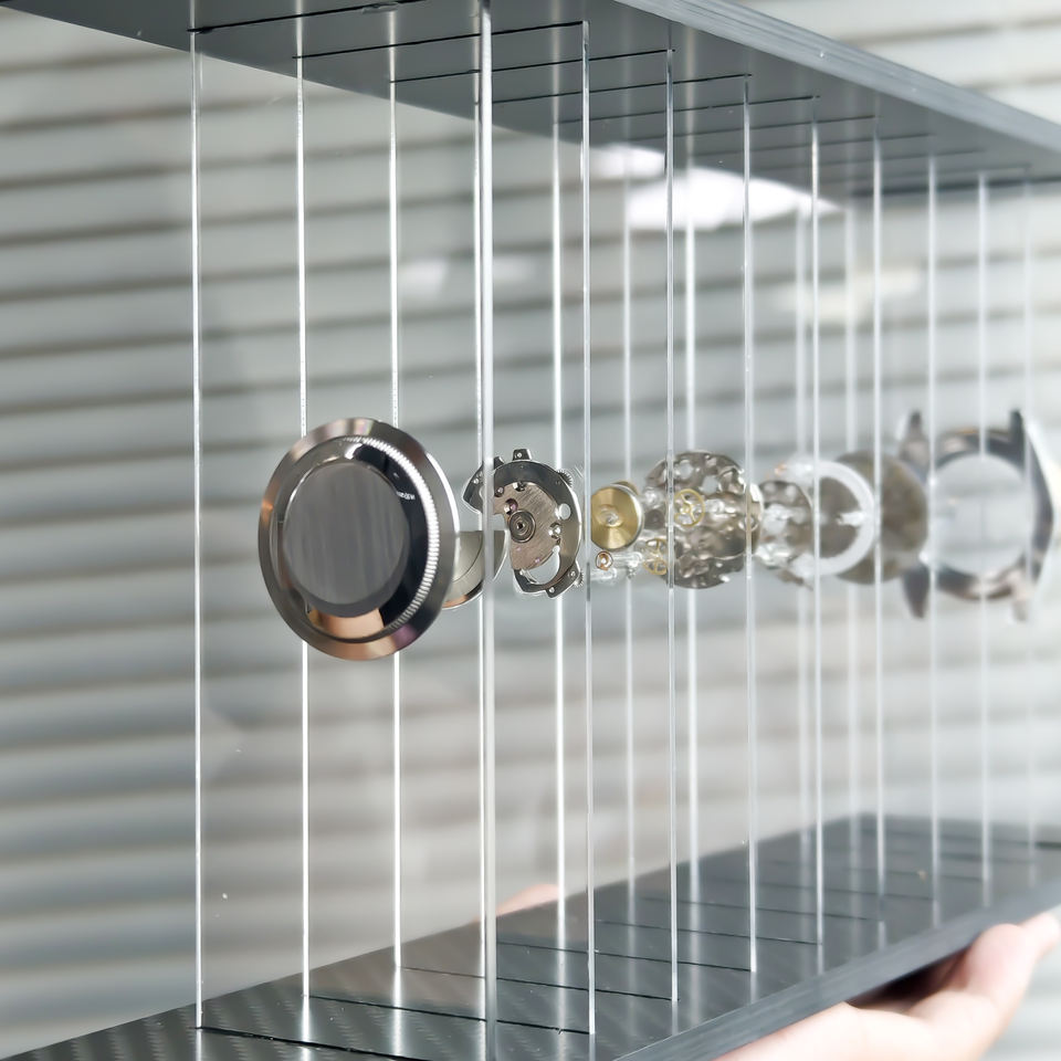 Close-up of a modern shower head and control panel with a metallic finish.