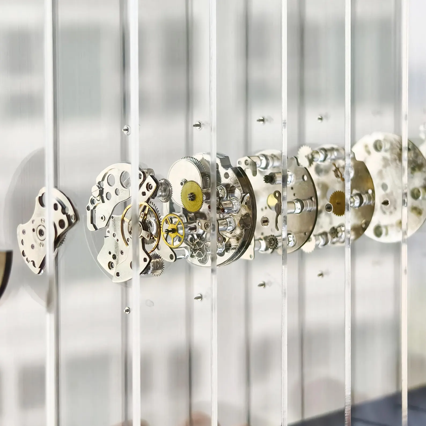 Close-up of mechanical watch movements on acrylic