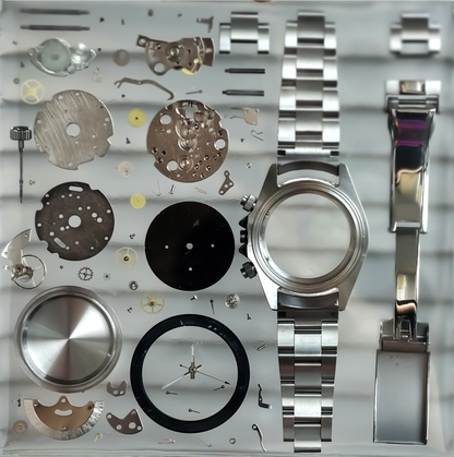 Silver watch components and parts on a metallic background Timepiece Craft 