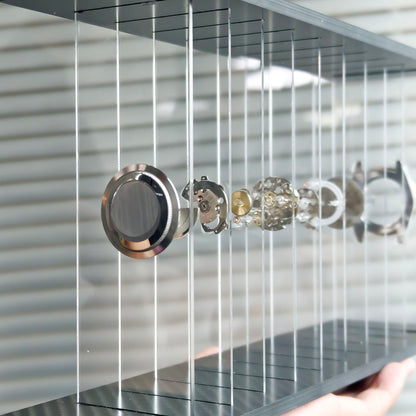 Close-up of a modern shower head and control panel with a metallic finish.