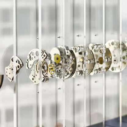 Close-up of mechanical watch movements on acrylic